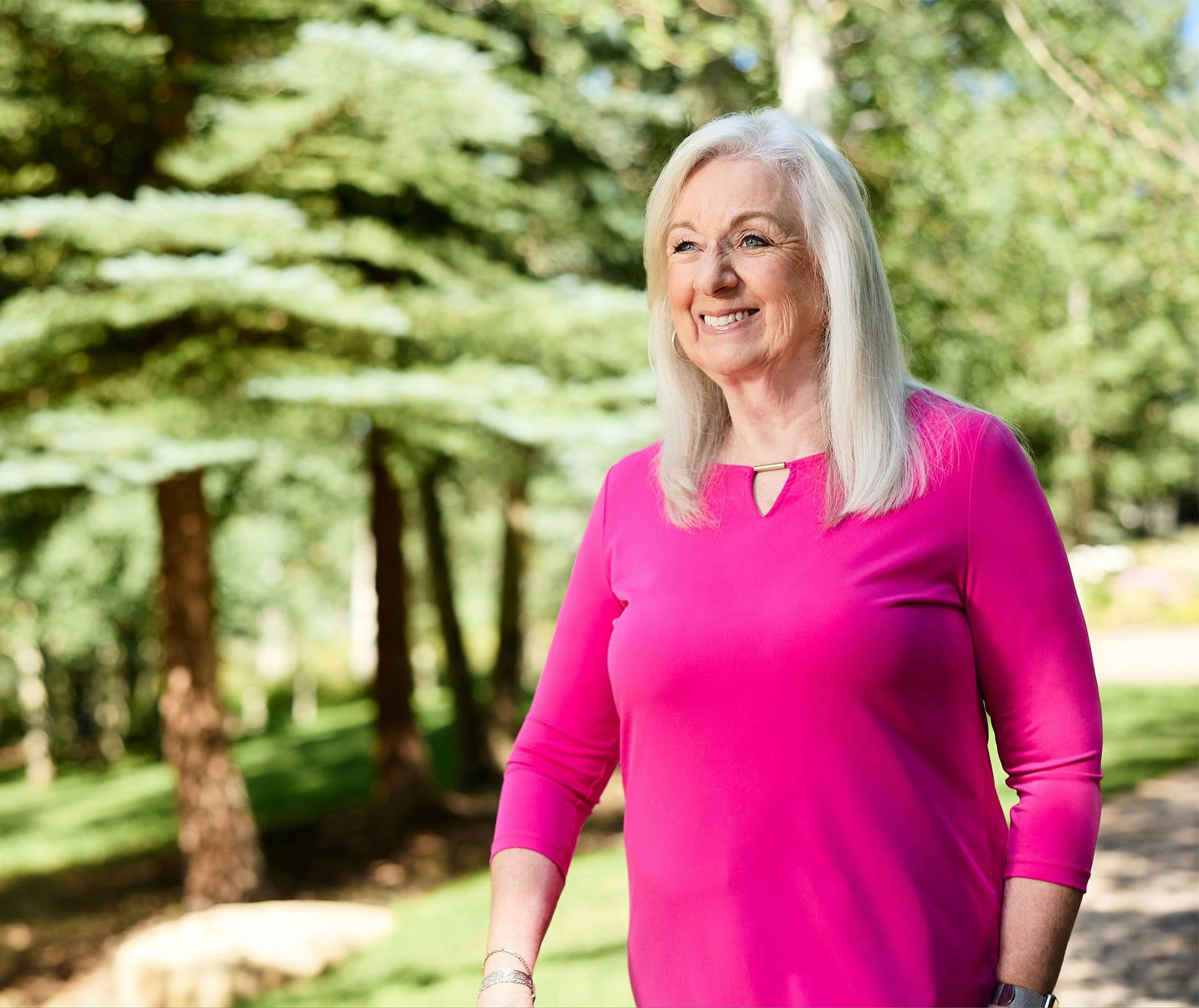 Woman in pink shirt outside