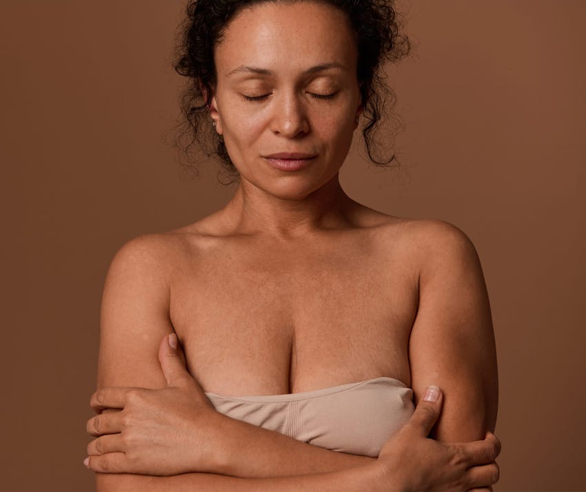 Woman crossing arms over her chest