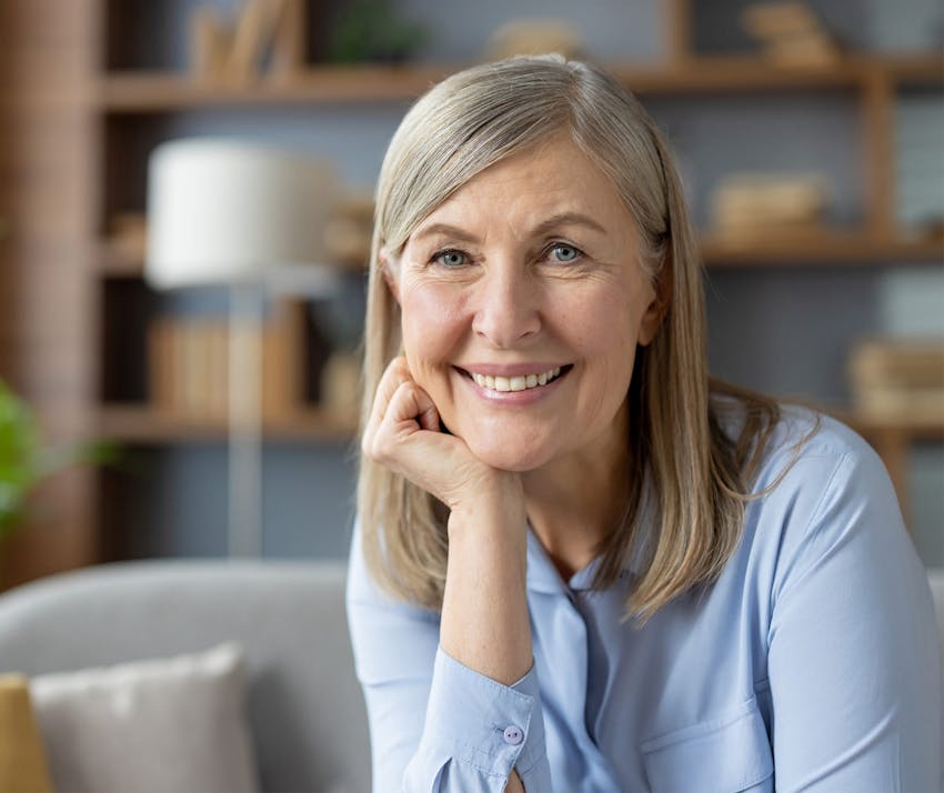 Woman resting head on hand