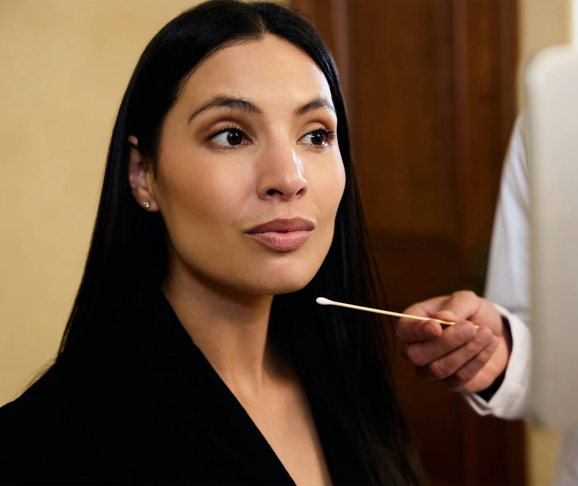 Woman receiving facial consultation