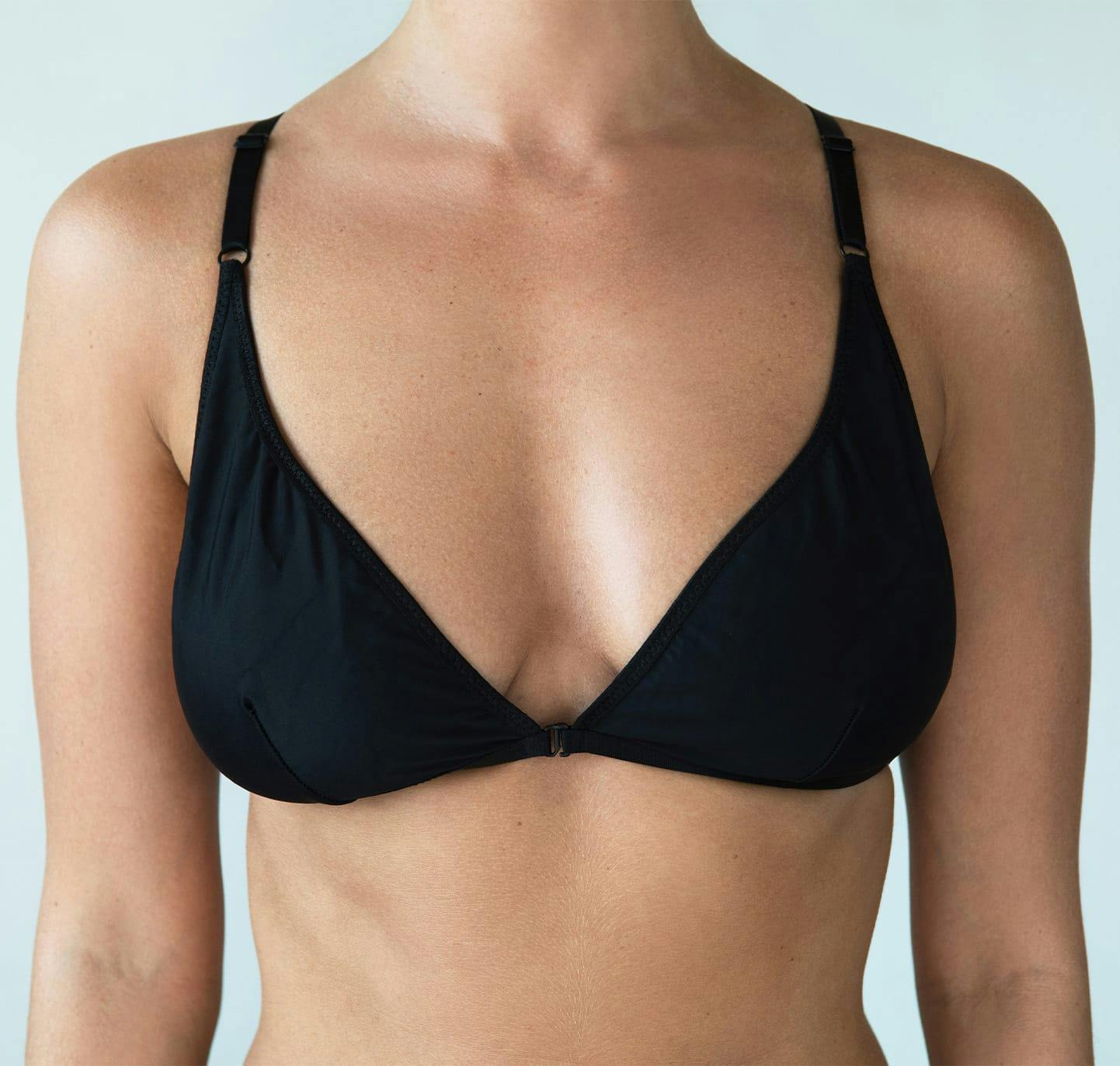 Woman's chest in black bra