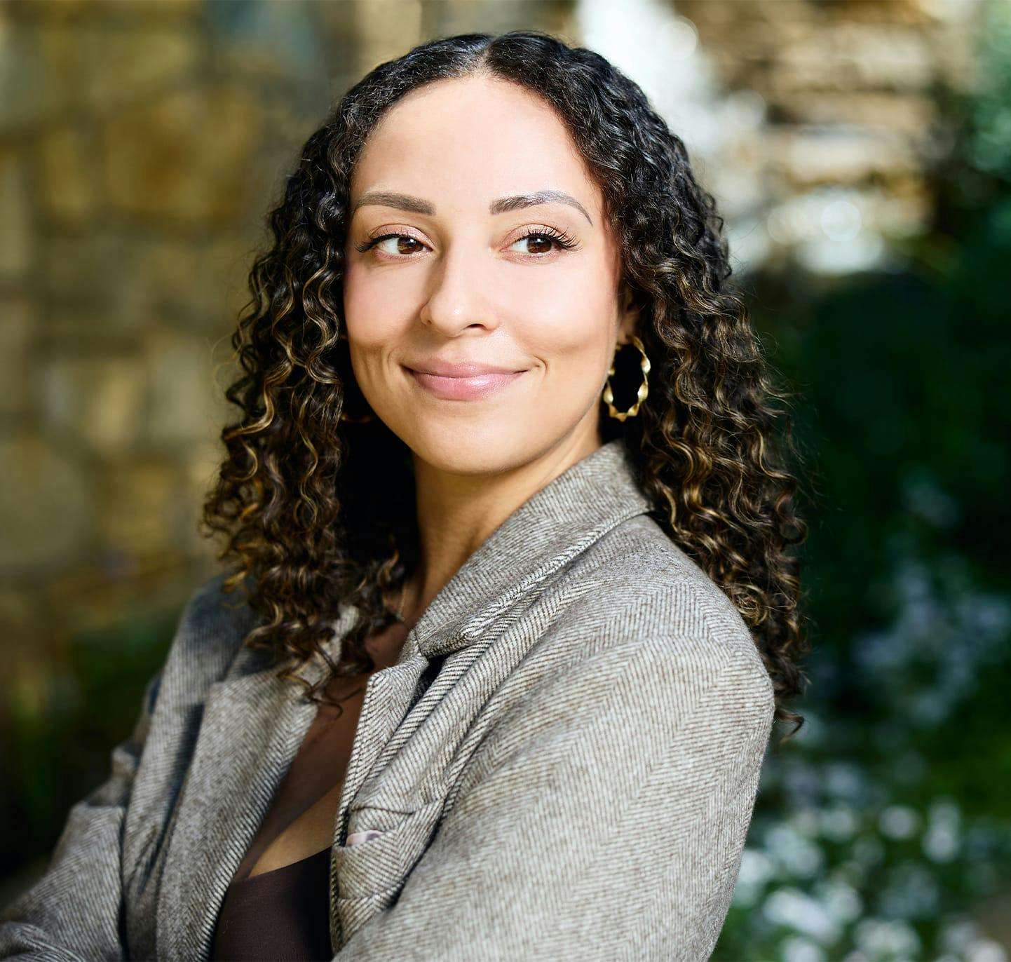 Woman with curly hair smiling