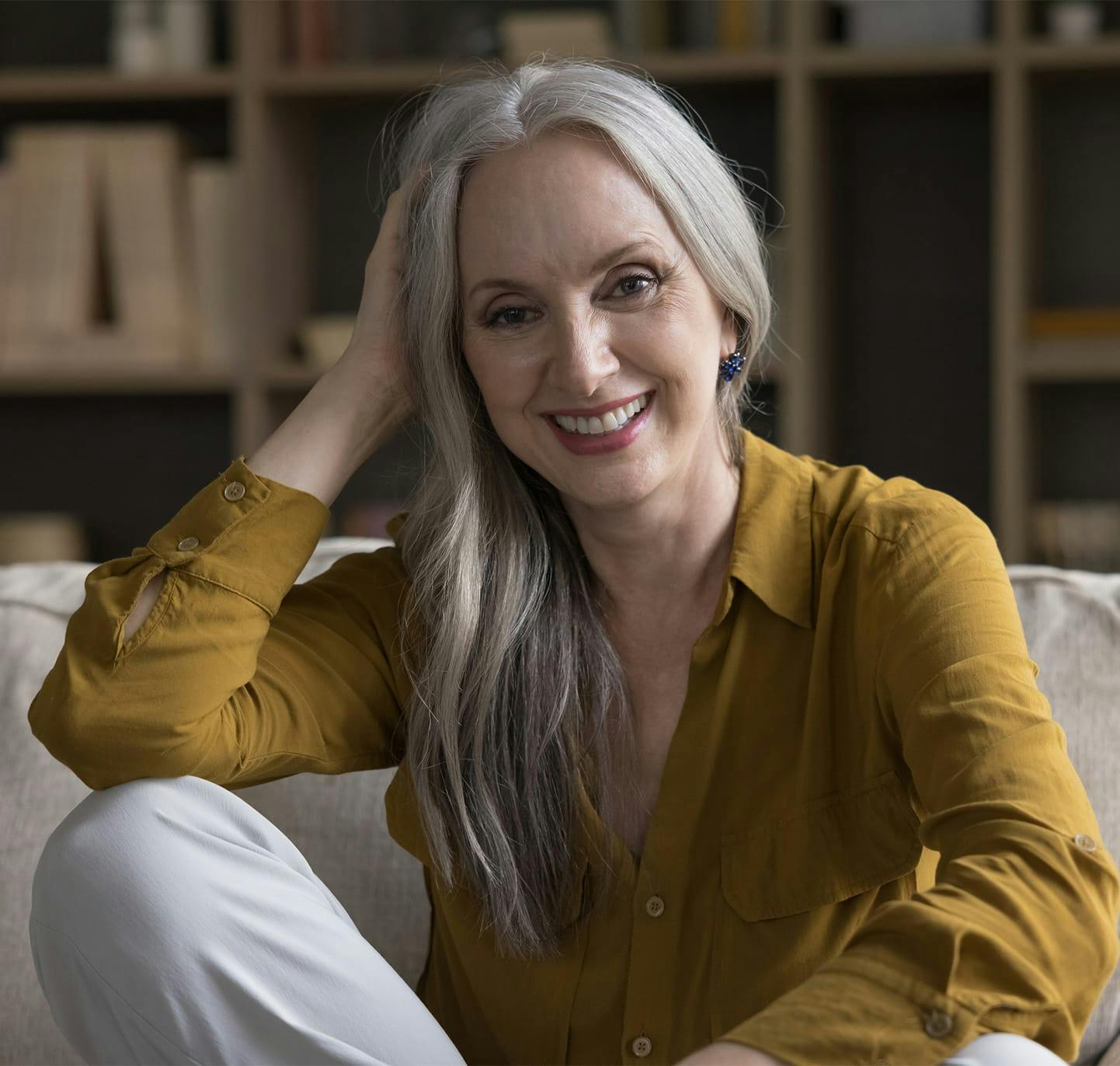 Smiling woman wearing green blouse