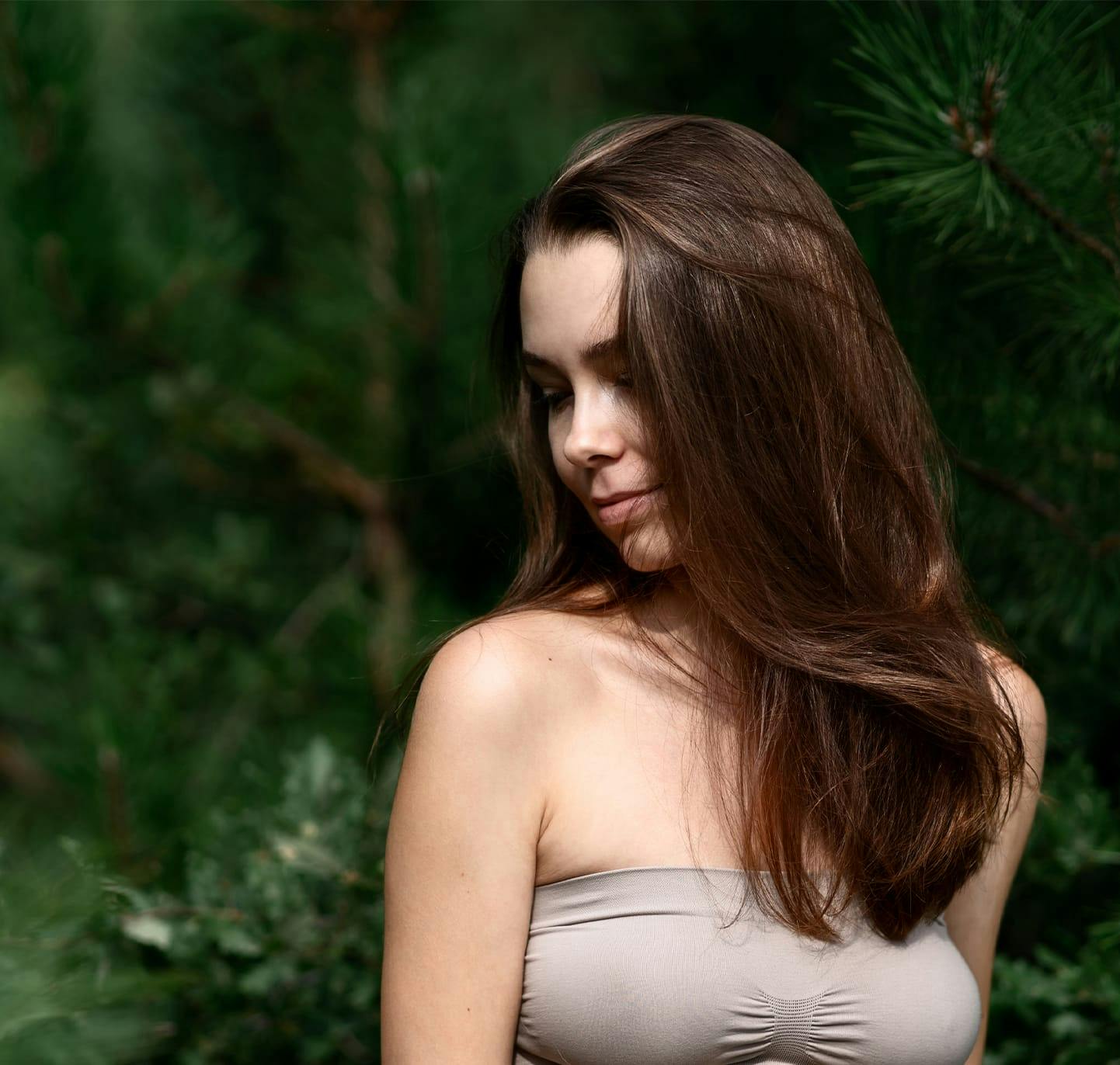 Woman smiling over her shoulder