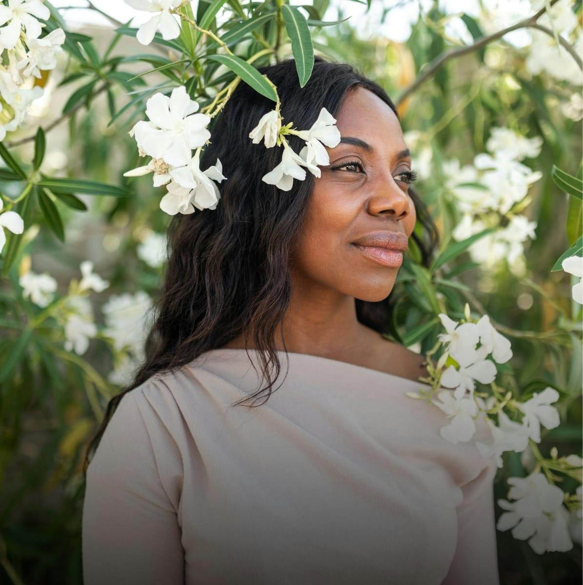 woman standing near white flowers