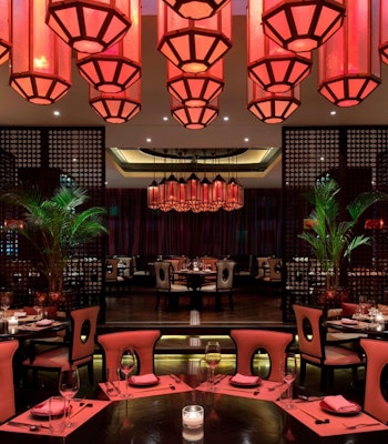 Award Winning Dining Elegant dining area with red lighting and modern decor.