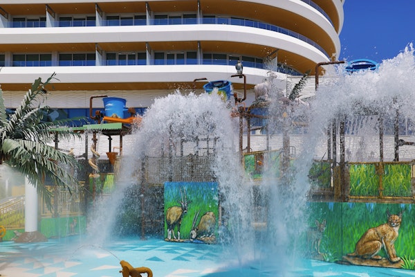 Waldorf Astoria Lusail, Doha Water play area with large water features, colorful animal-themed murals, and a hotel building in the background.