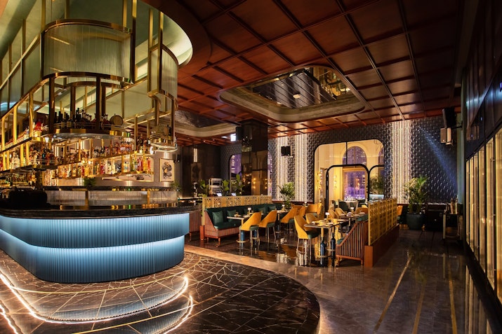 Escape to Europe Chic bar with elegant seating, glowing lights, and a modern design