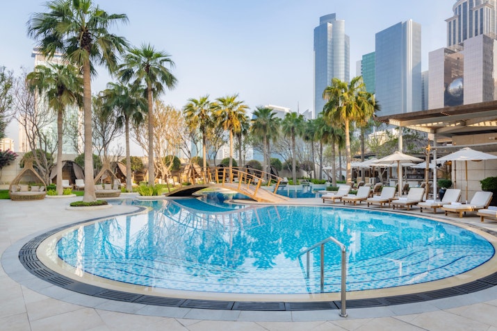 Swimming pool with city sklyine