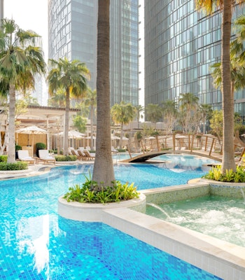 JW Marriott Marquis City Center Doha Swimming pool with palm trees