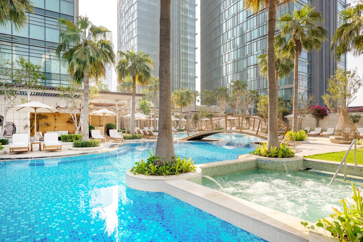 JW Marriott Marquis City Center Doha Swimming pool with palm trees