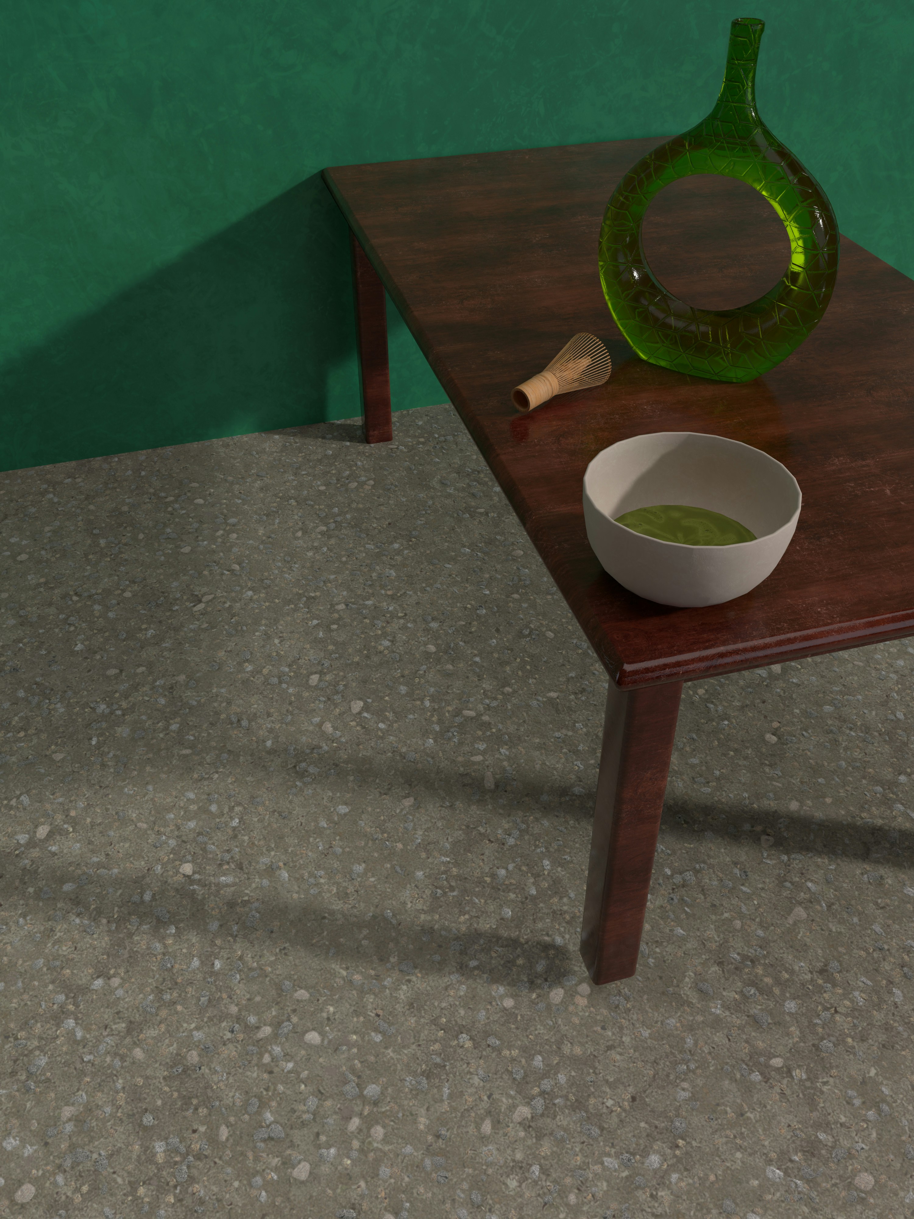 Bowl of matcha on a wooden table with a whisk and green glass vase