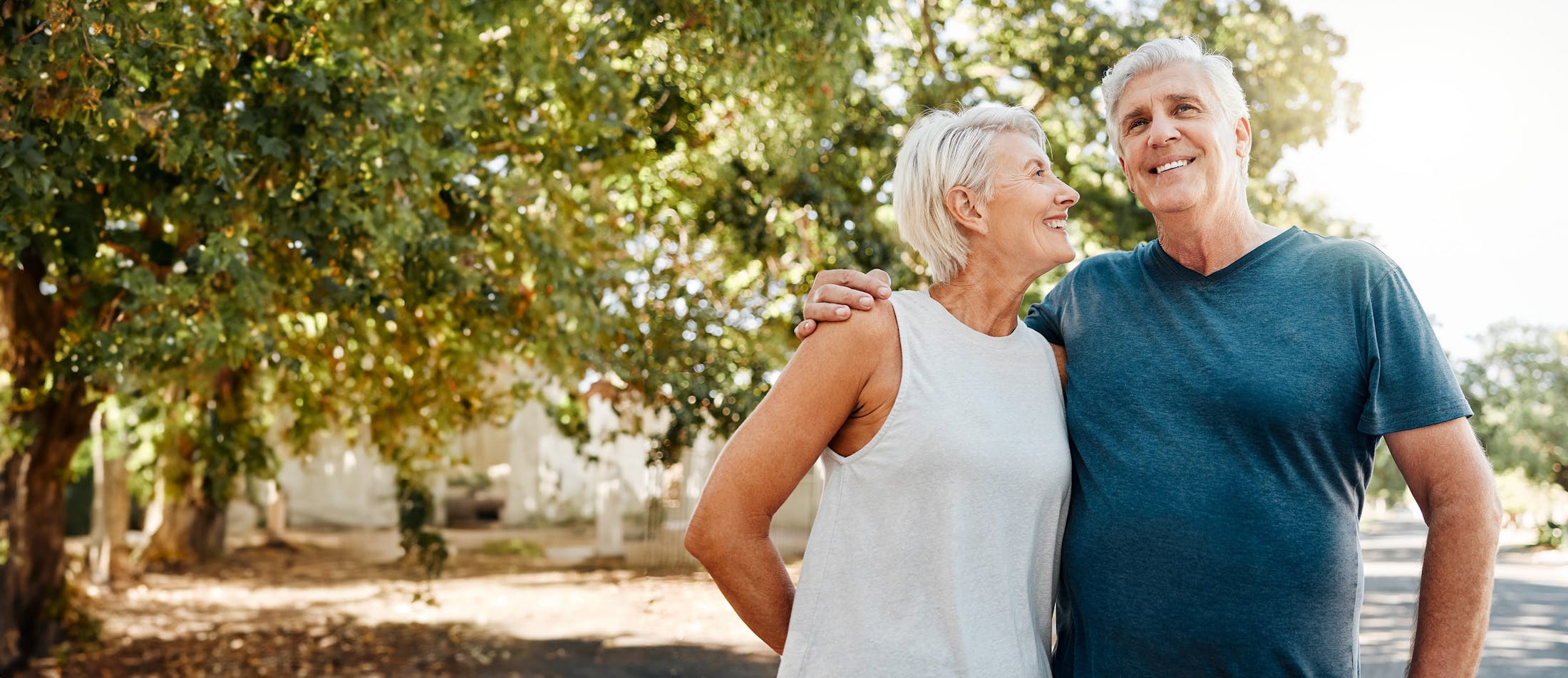 couple smiling outside
