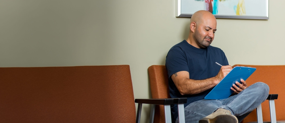 man filling out form