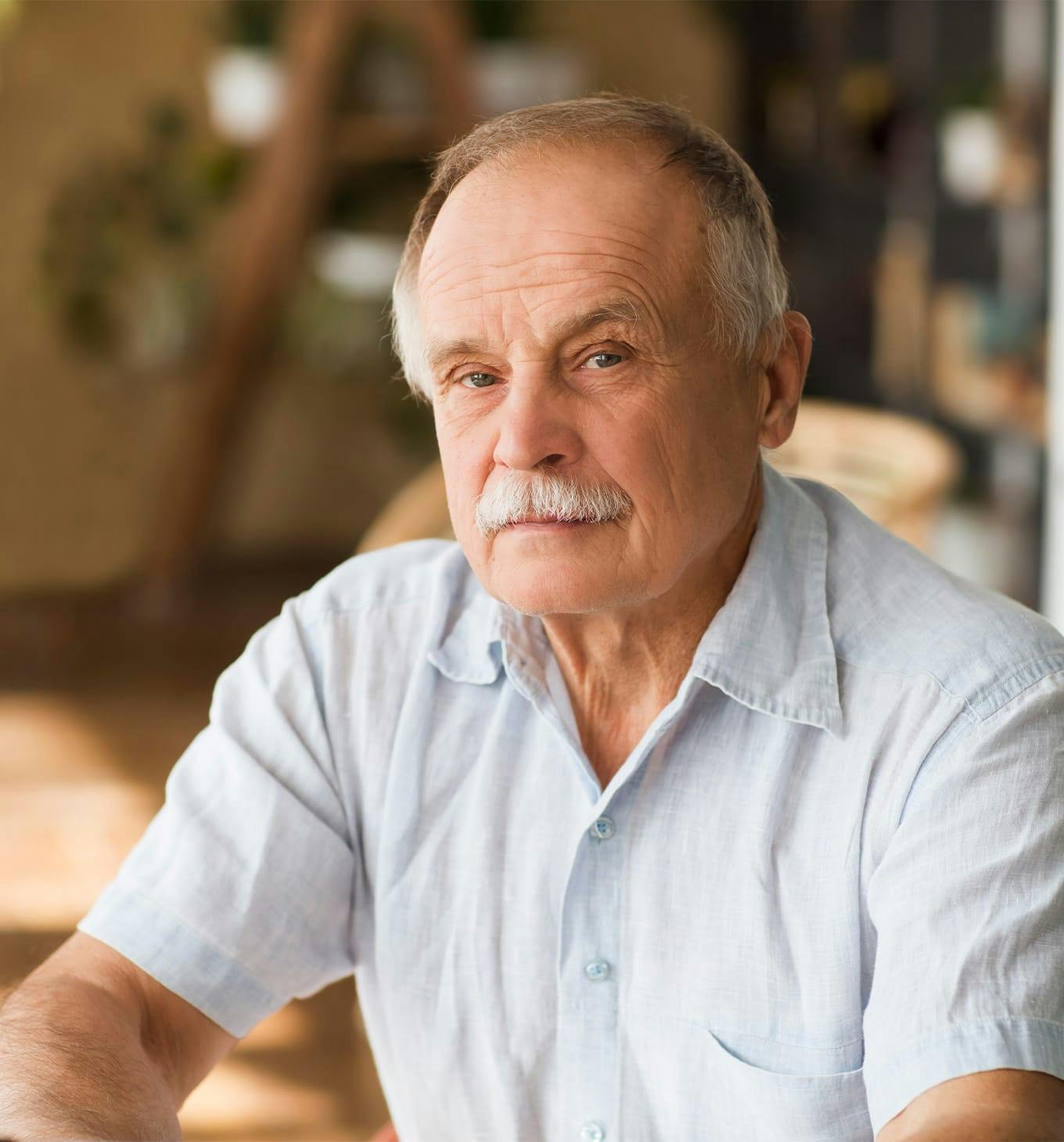 older man with a grey moustache