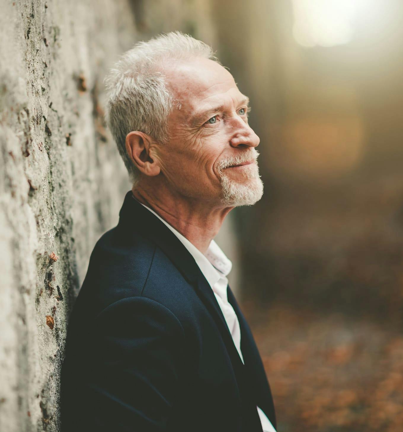 man leaning against wall