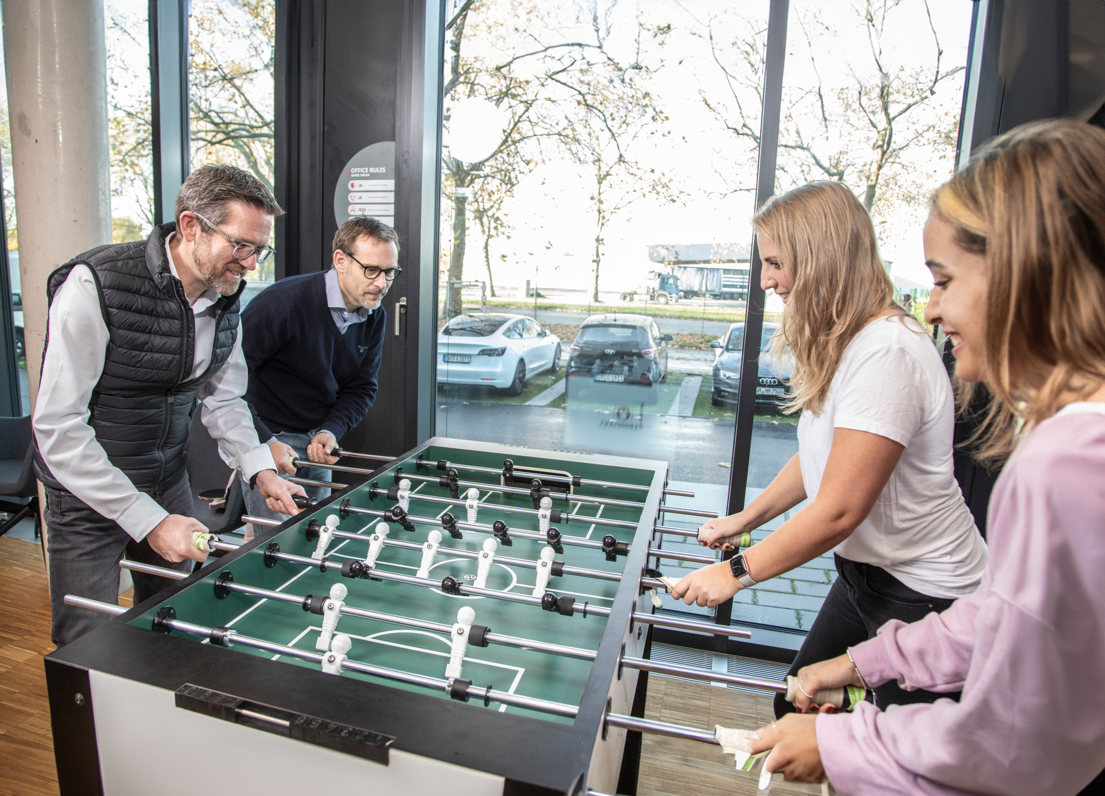 People playing table soccer