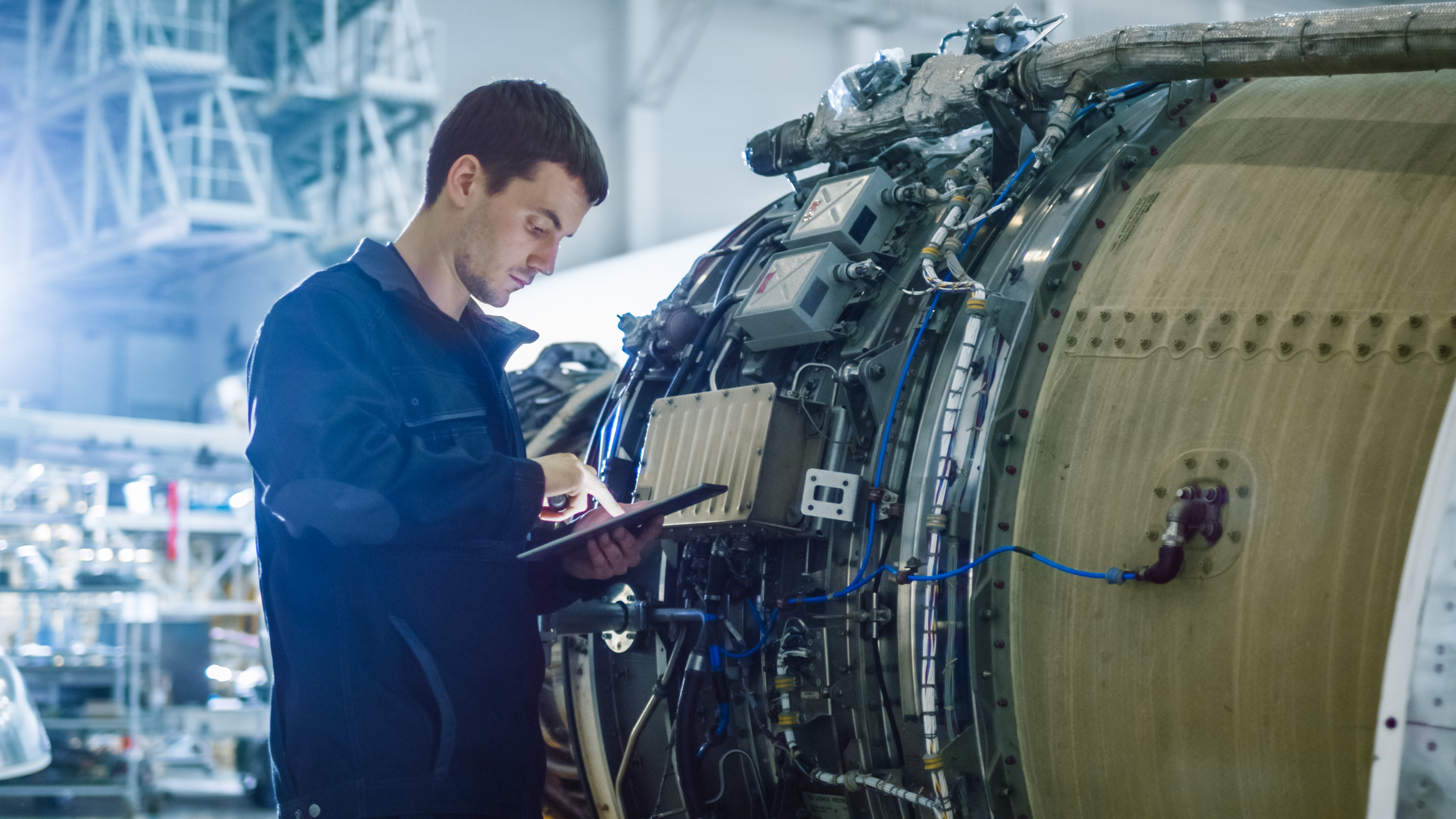 A technician inspects and services an industrial machine, ensuring its continued functionality and efficiency.
