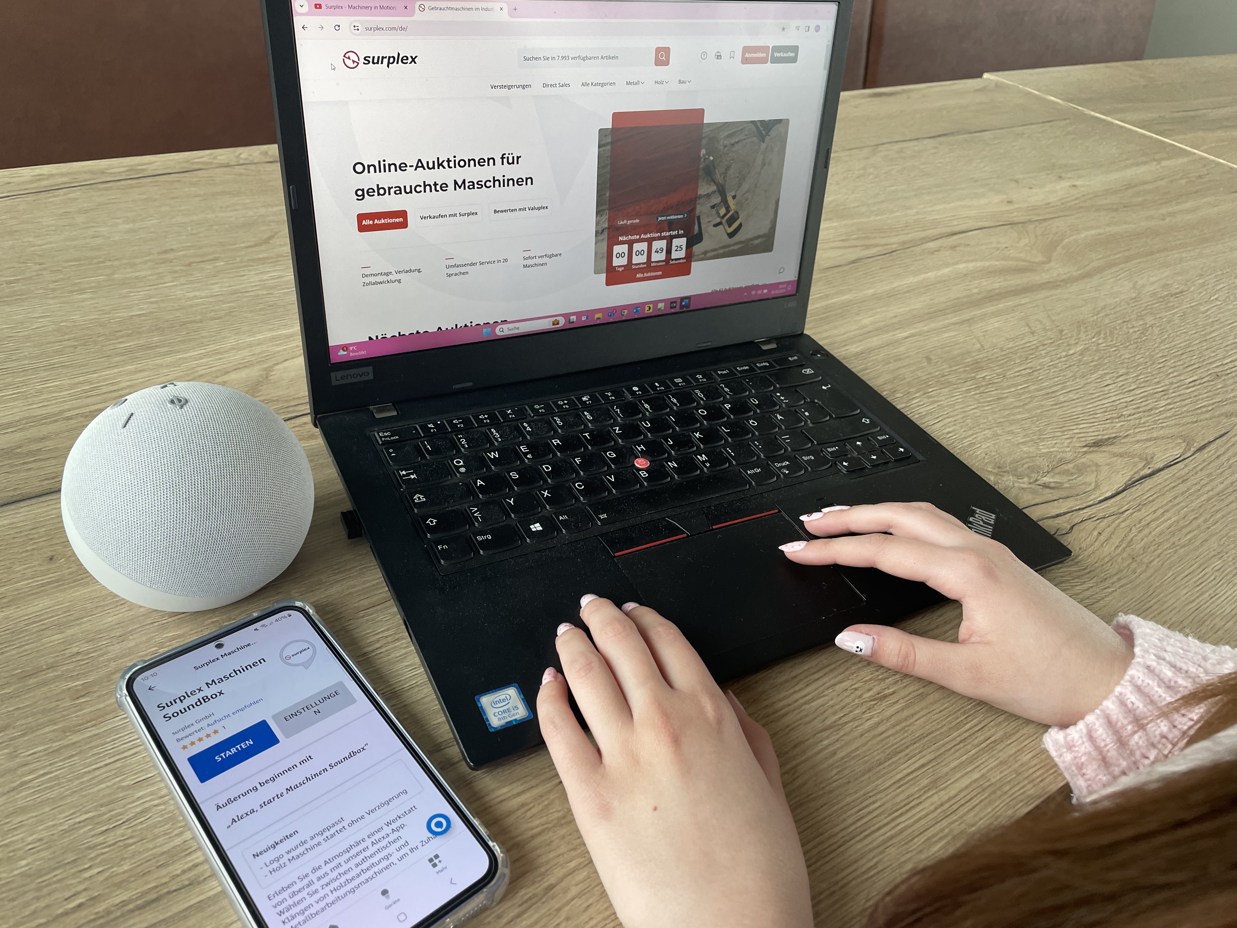 A woman using a laptop with the Surplex website open, playing ASMR sounds of metal and woodworking machines on an Alexa device.