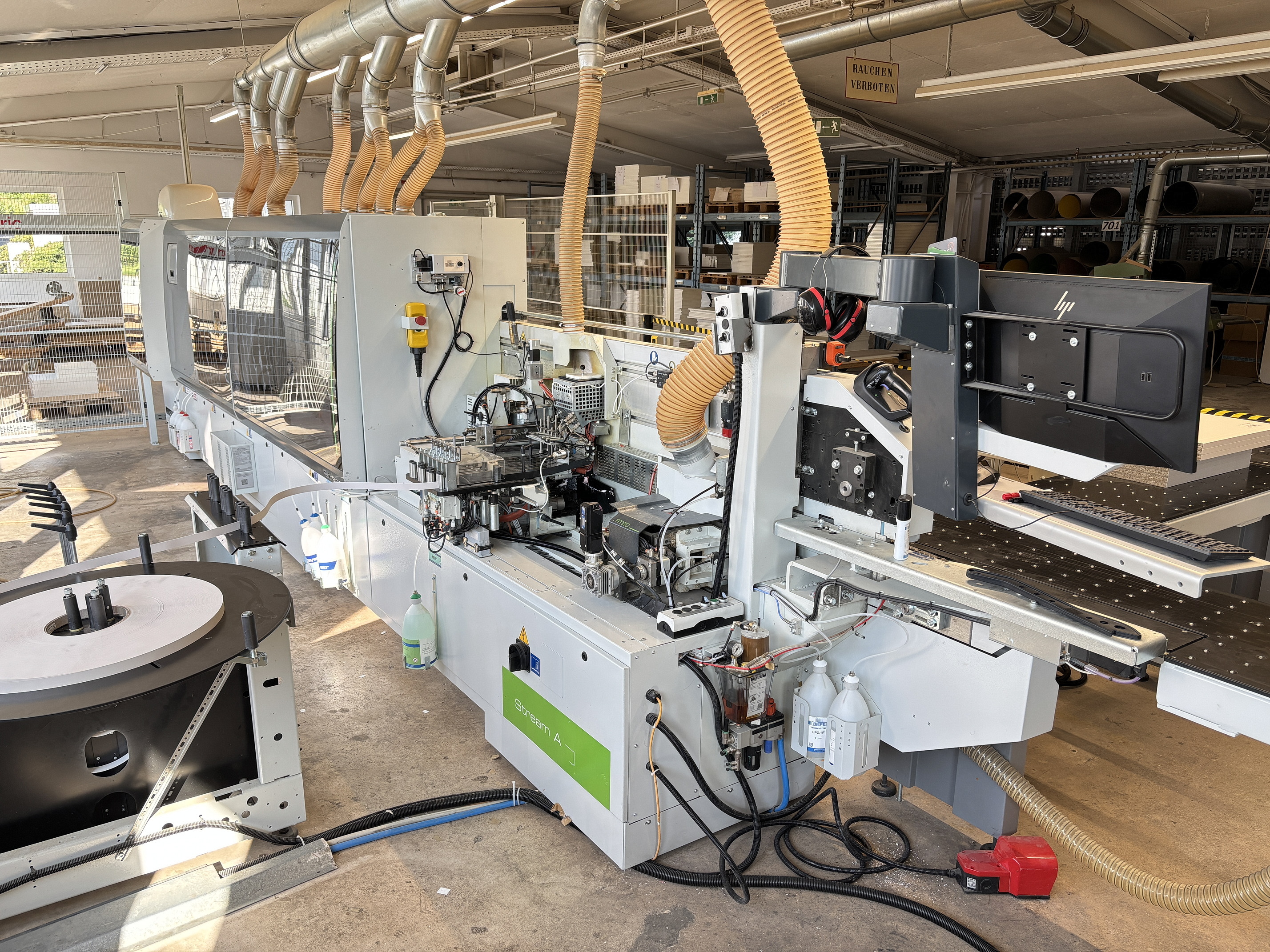 A new, well-maintained, and high-end BIESSE STREAM A 7.0 with a BARBARIC RTS 02 edgebanding cell. The machines were built in 2022 and have only produced one shift.  BIESSE STREAM A 7.0 edgebander Year of manufacture 2022, machine no. 1000055891  Equipment and Technical Specifications -	Control system with Smart Touch 23" -	Angle guide with electro-pneumatic device -	Infeed guide NC-controlled -	Jointing unit RT20 with 2 motors, each 3.5 kW -	Workpiece thickness approx. 10 – 60 mm -	Hybrid gluing unit VC-710 for EVA/PUR with NC glue flow control -	Glue pots 2 additional -	Edge magazine 6-position -	Edge thickness for rolled material 0.4 – 3 mm -	Pressure roller with NC-controlled -	Cross cut saw unit IT70-P with NC-controlled axes -	Flush trimming unit RS-100 top/bottom with Pro-Nesting Kit -	Profile trimming unit RF400 top/bottom with axis control and Pro-Nesting Kit -	Profile trimming unit AR30 NC with 2 motors (post- and softform) and Q-System -	Profile scraper RB400 multi, NC-controlled, and Pro-Nesting Kit -	Flat scraper RCC-701 -	Universal milling unit FB40 for profiling, grooving, and slotting motor approx. 5 kW, NC-controlled in Y and Z directions -	Buffing unit SP-501 -	- Cleaning Spray Units  BARBARIC RTS 02 Material Return System with Stacking Year of 2022, Machine No. 2212312-258  Material Return System and Conveyor Belt Material Stacking System in the Rear Area  Equipment and Technical Data -	Rotating Unit 0° - 90° - 180° -	Manipulator RTS Professional, suction beam 500 x 500 mm -	Stacking function with layer formation -	Workpiece length approx. 300 - 2800 mm -	Workpiece width approx. 80 - 1300 mm -	Workpiece thickness approx. 8 – 60 mm -	Panel weight maximum approx. 90 kg -	Stacking height maximum approx. 1200 mm from a EURO pallet -	Cycle time maximum approx. 10 cycles/minute When removing from the removal belt to the return belt -	Conveyor belt width approx. 800 mm -	Outfeed with lifting table  My contact details for a quote request Ludger Reuther Mobile +49 173 6172604 Email lre@surplex.com