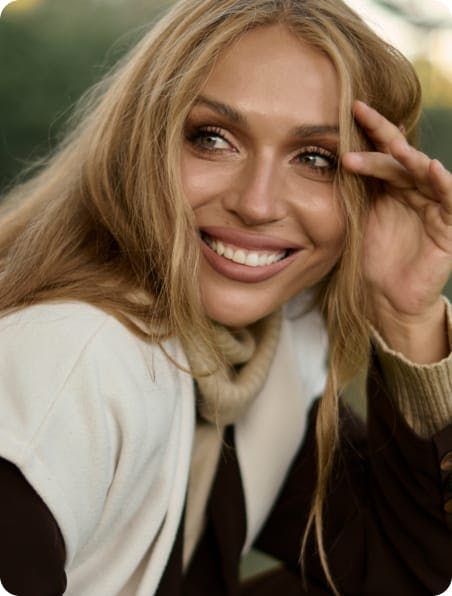 woman with long blonde hair smiling