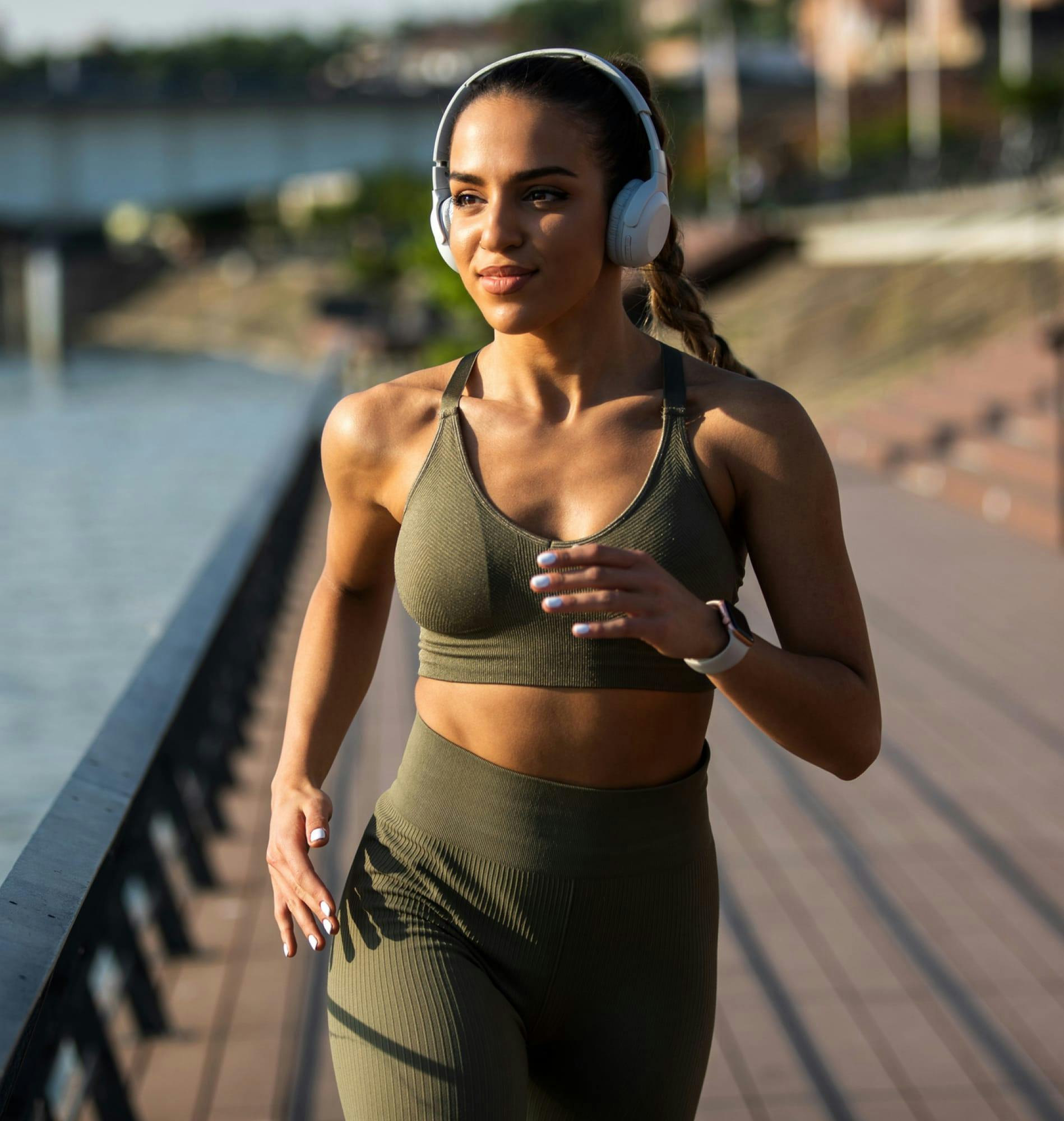 Woman jogging by some water