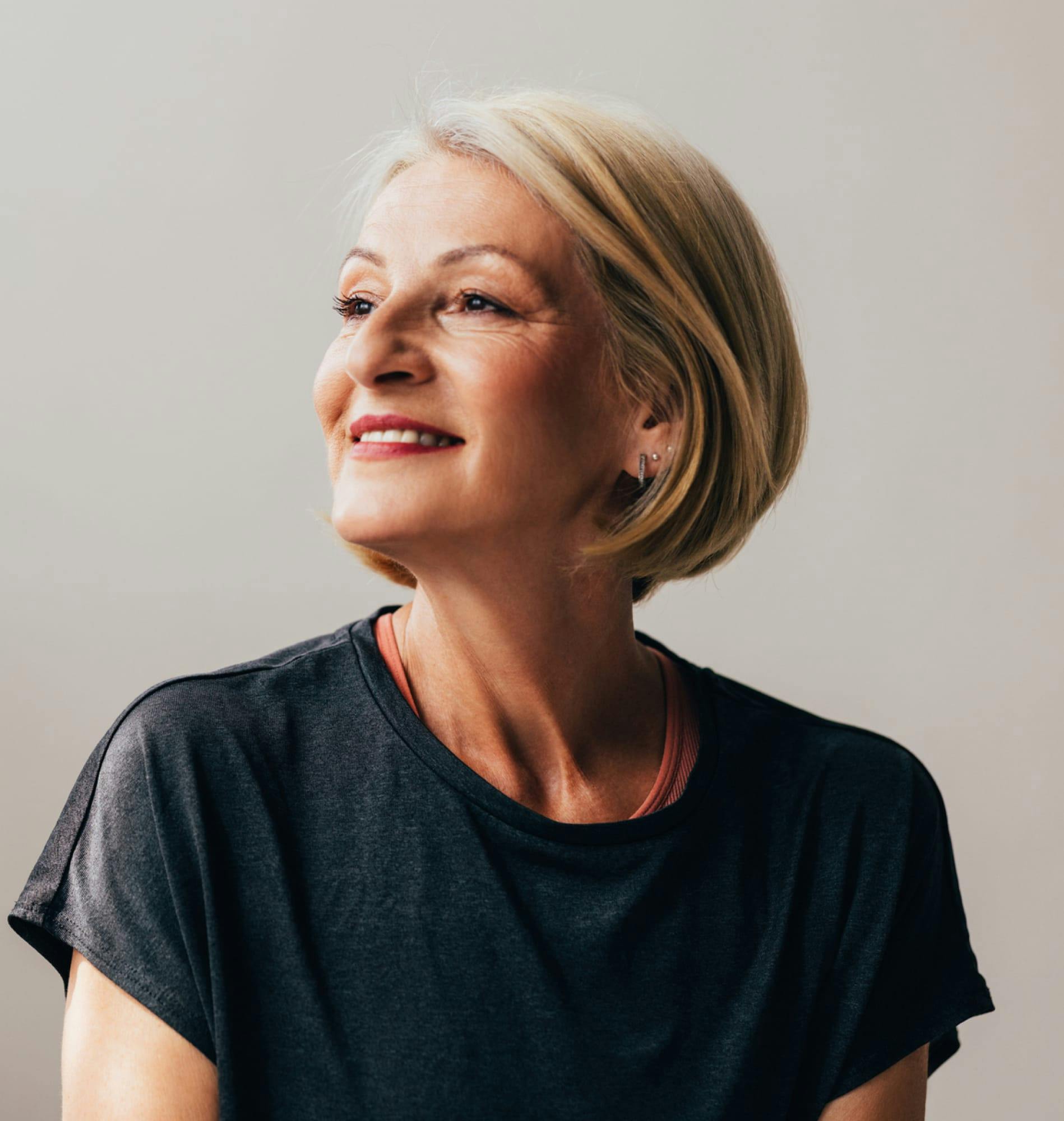 Woman looking to the side and smiling