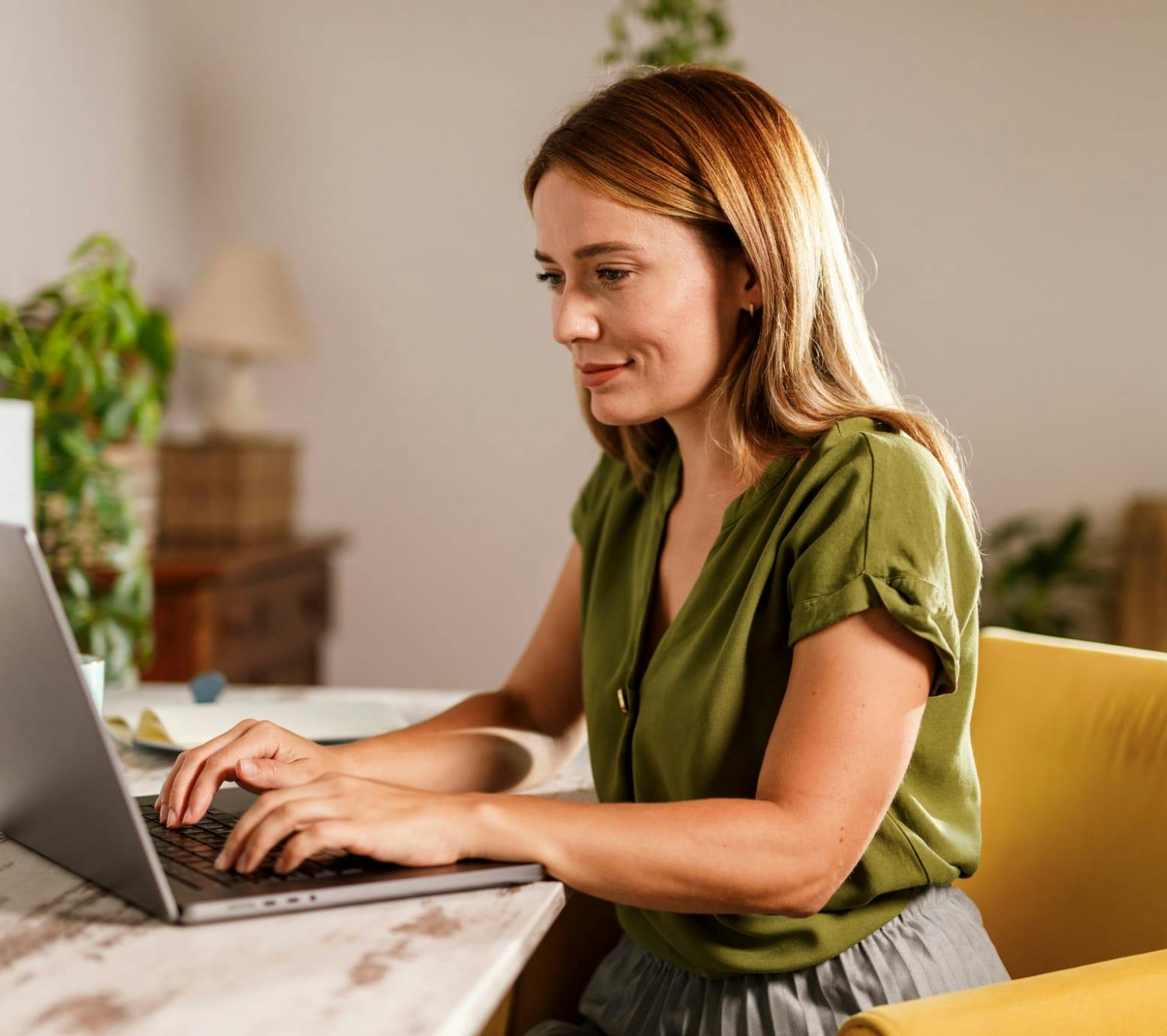 Woman sitting and working at her computer