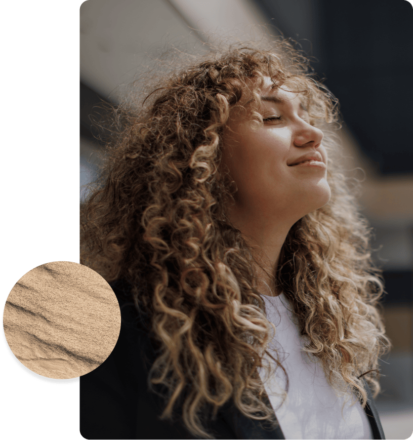 woman smiling with eyes closed