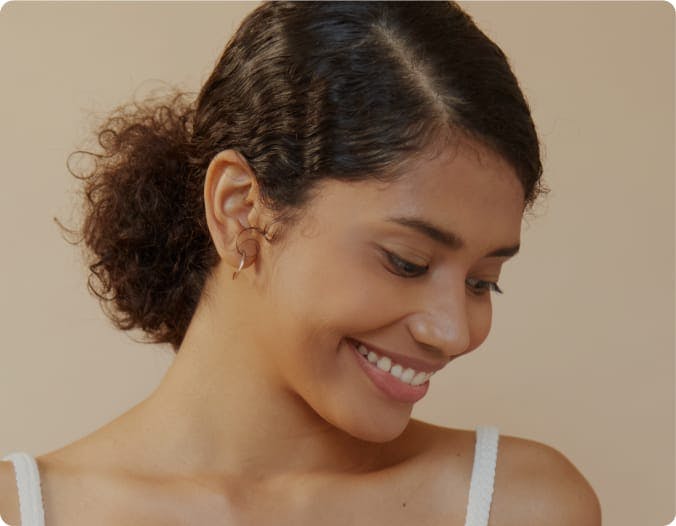 Woman looking down and smiling
