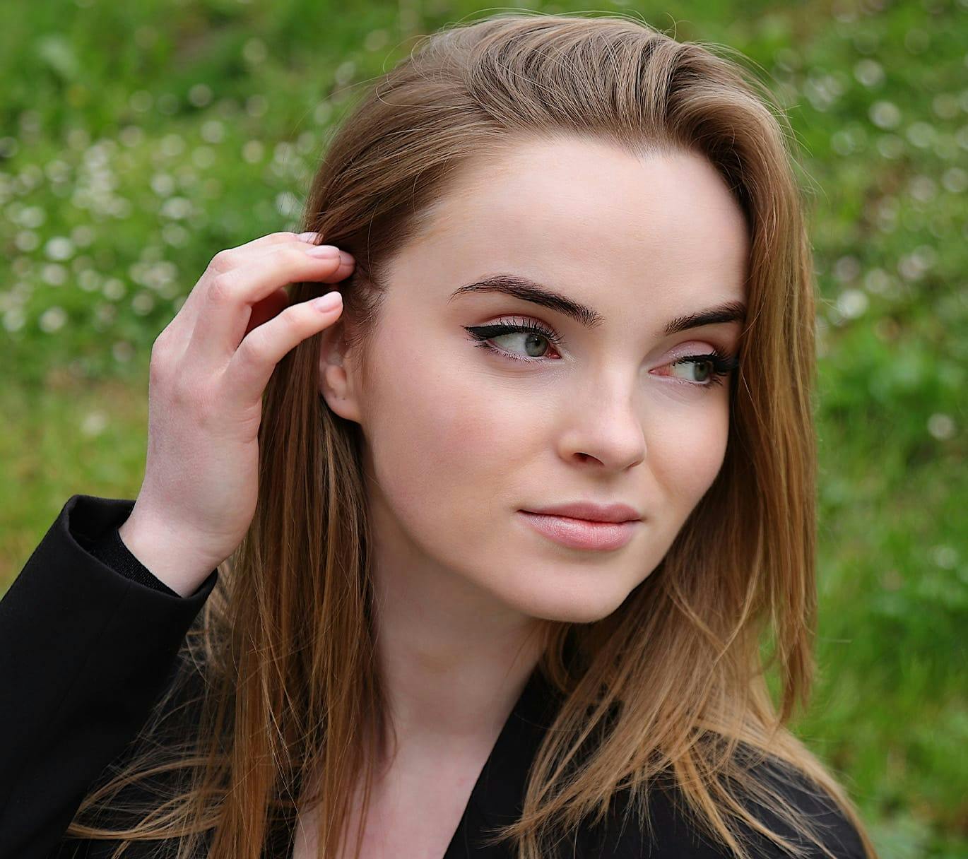 woman outside touching hair