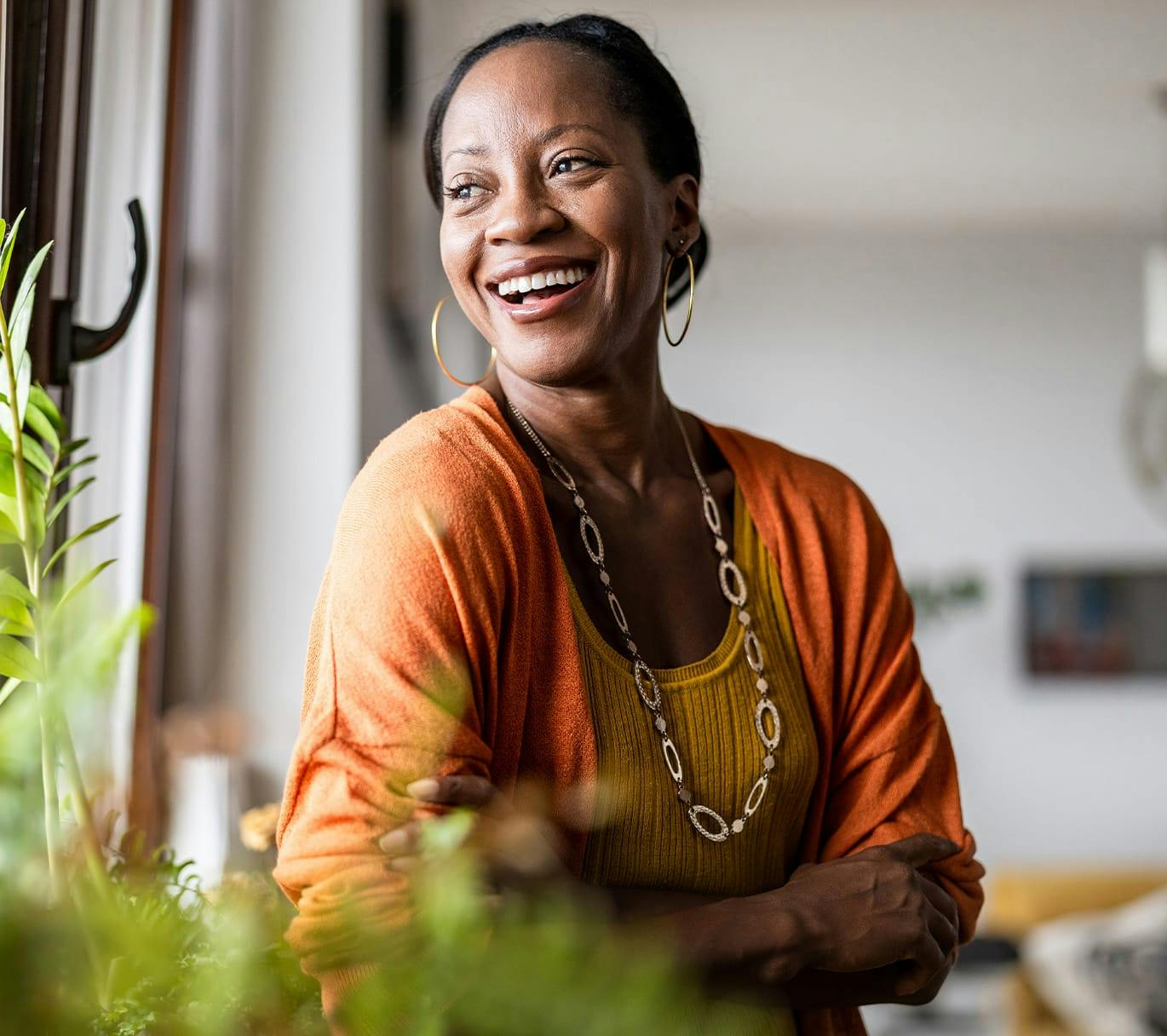 woman in an orange cardigan