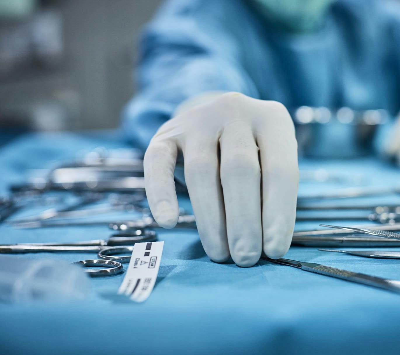 hand on surgical instruments table