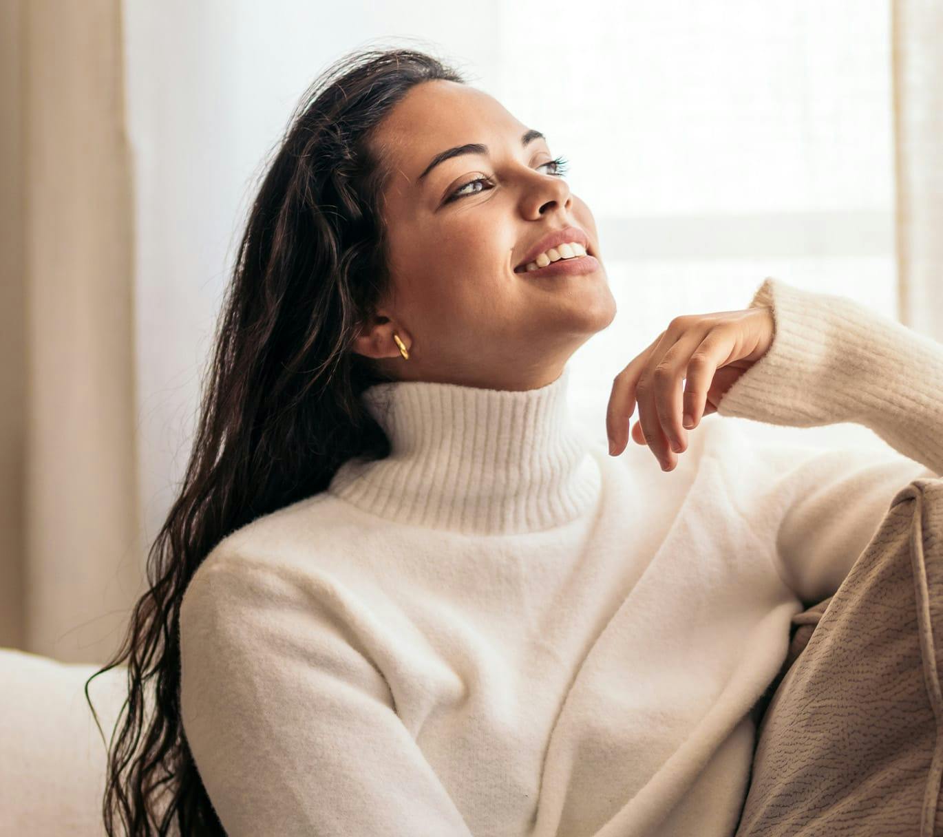 smiling woman in turtleneck