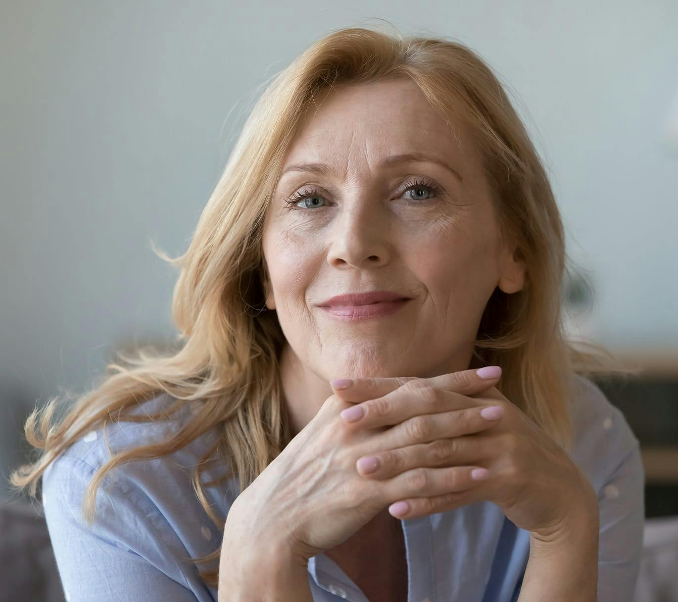 woman with her fingers interlaced