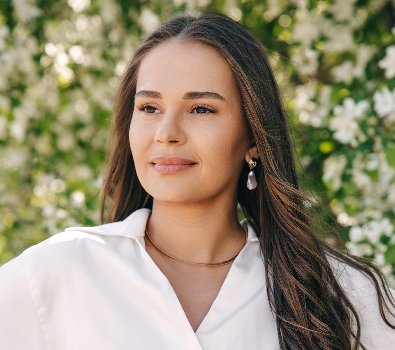 woman infront of flowers