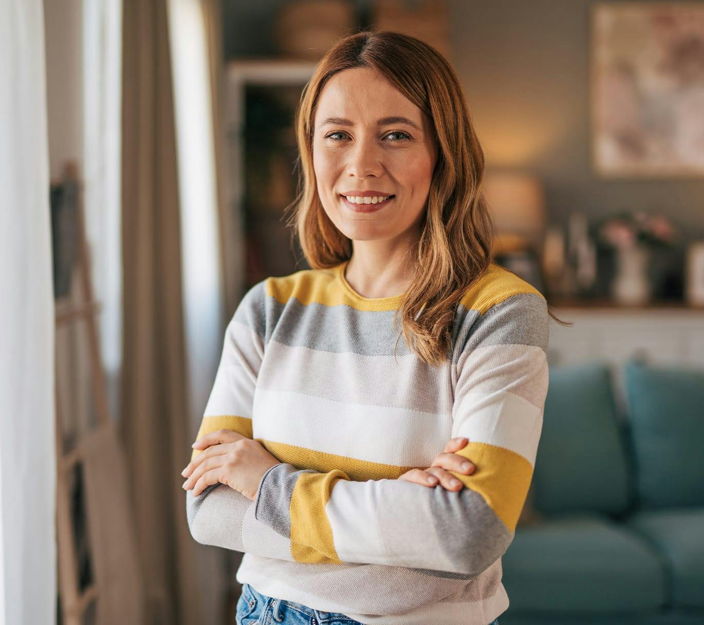 woman standing with her arms crossed