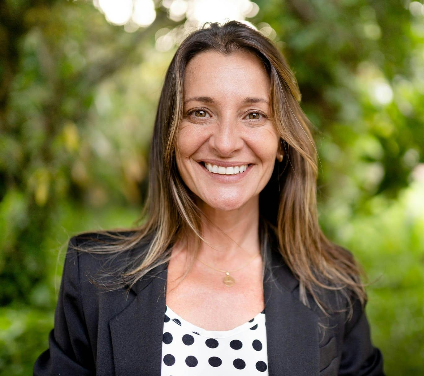 woman smiling in blazer