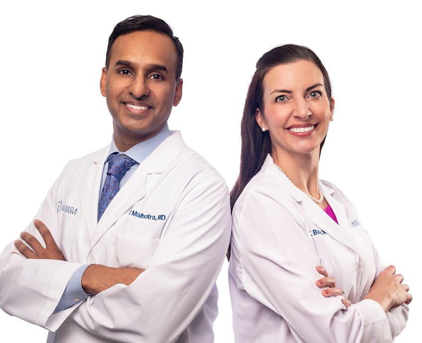 Doctors standing and smiling