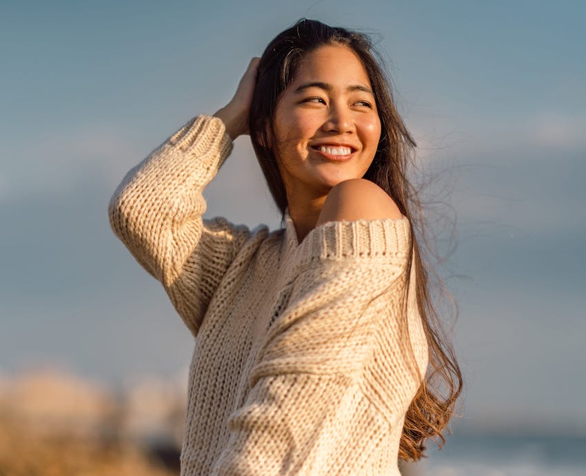 woman turned to the side and smiling