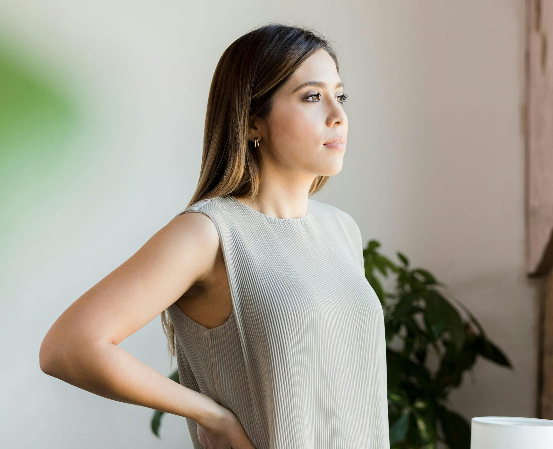 woman standing with arms akimbo