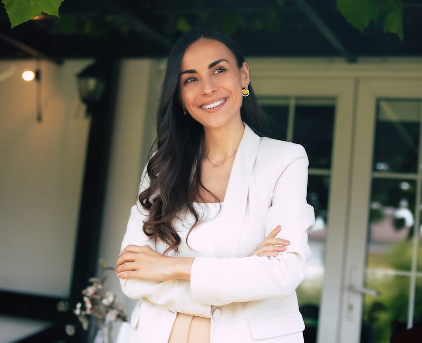 woman standing with her arms crossed