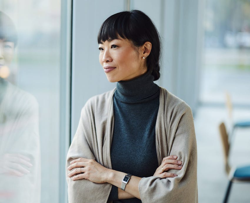 woman looking out office window