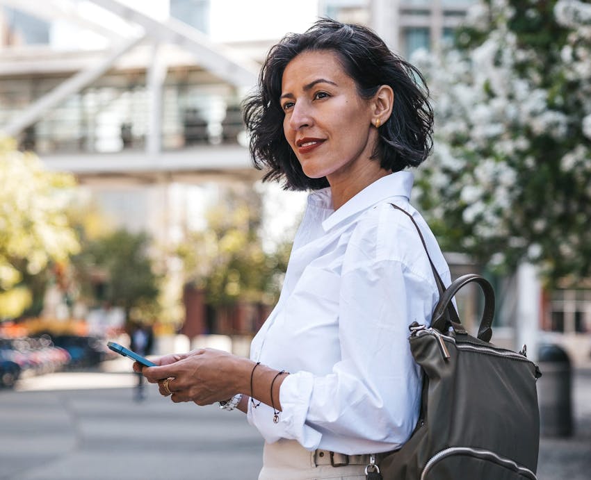 woman standing outside on phone