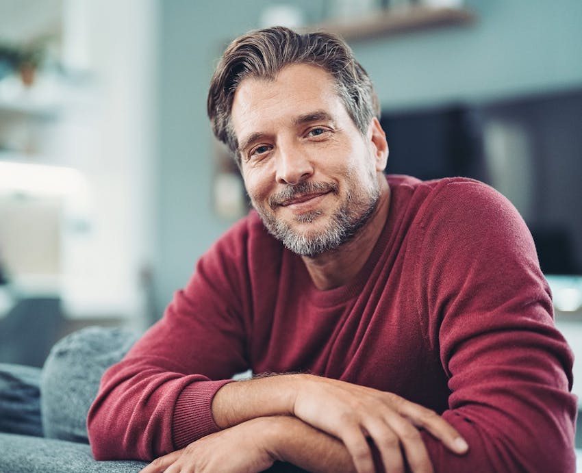 man leaning on table