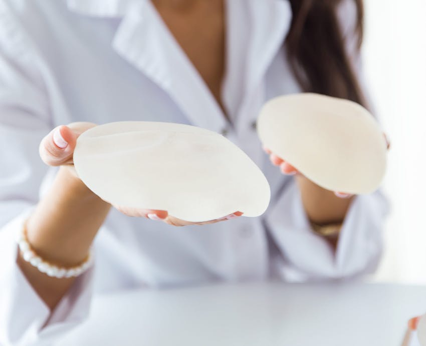 nurse holding implants