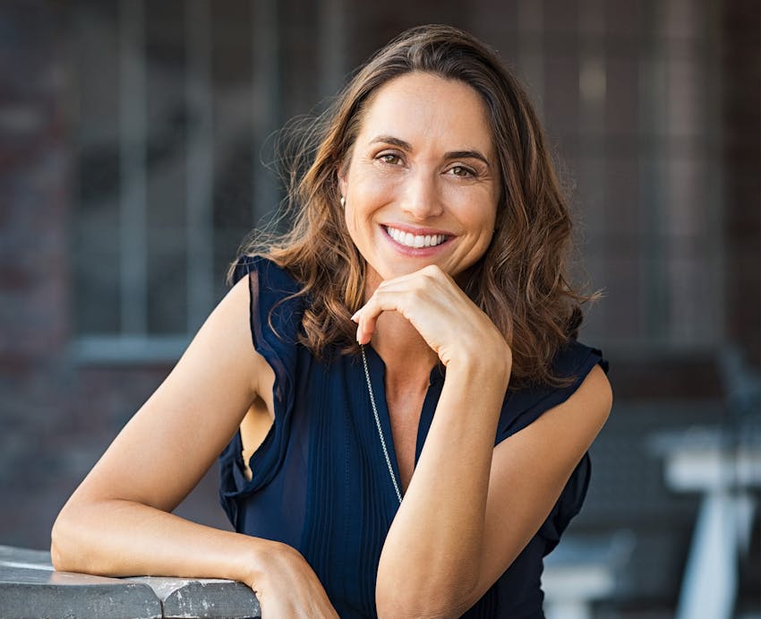 woman with hand under chin