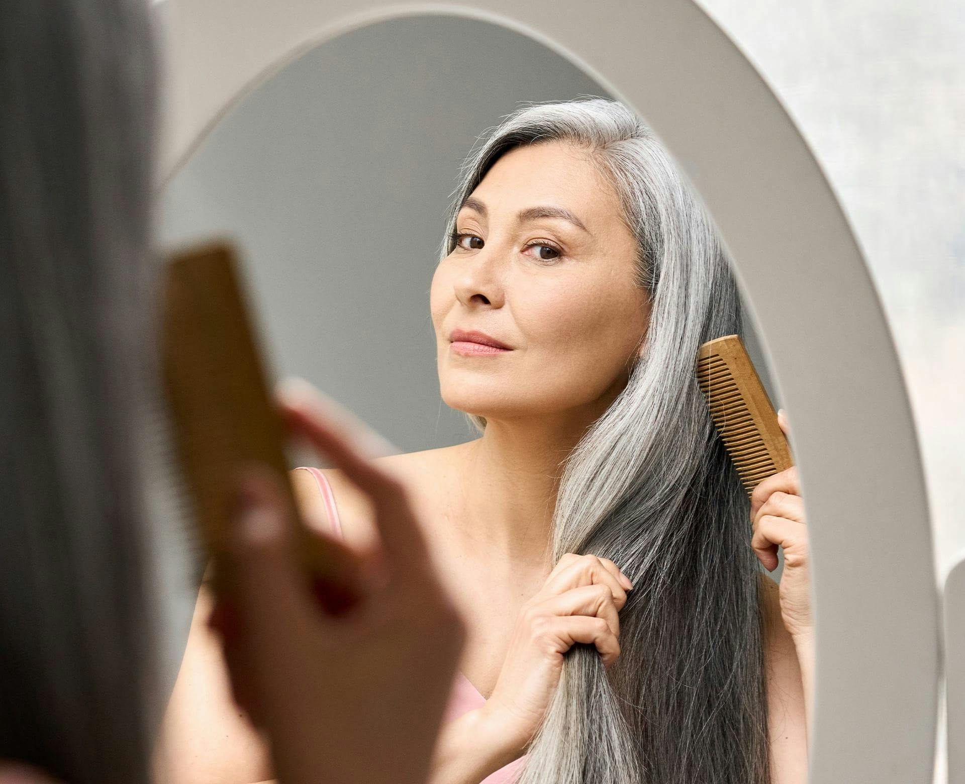 woman brushing her hair