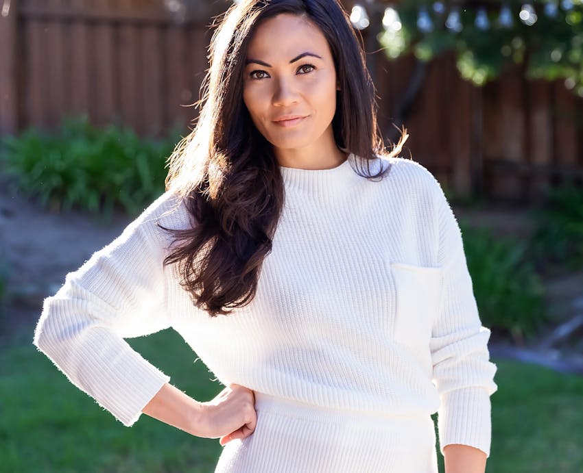 woman standing outside with hand on hip