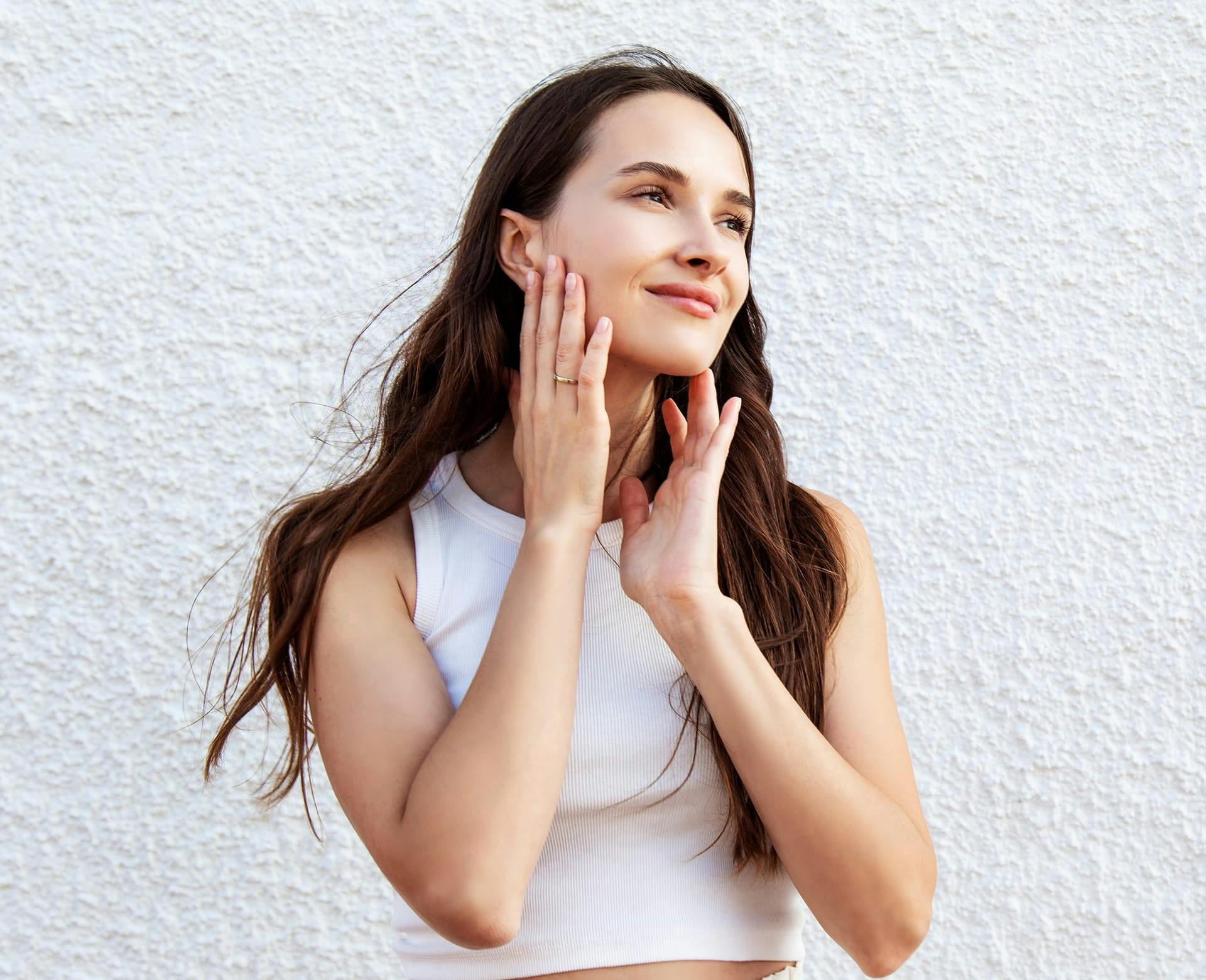 woman touching face